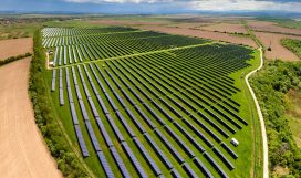 Aerial view of big sustainable electric power plant with many ro Aerial view of big sustainable electric power plant with many rows of solar photovoltaic panels for producing clean ecological electrical energy. Renewable electricity with zero emission concept.