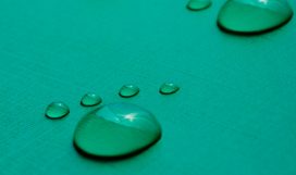 Footprints Footprints accomplished on the basis of drops of water on a green background