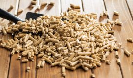 Wooden pellets, biofuel on wooden table. Ecologic fuel made from biomass. Renewable energy source. Wooden pellets, biofuel on wooden table. Ecologic fuel made from biomass. Renewable energy source on wooden table.